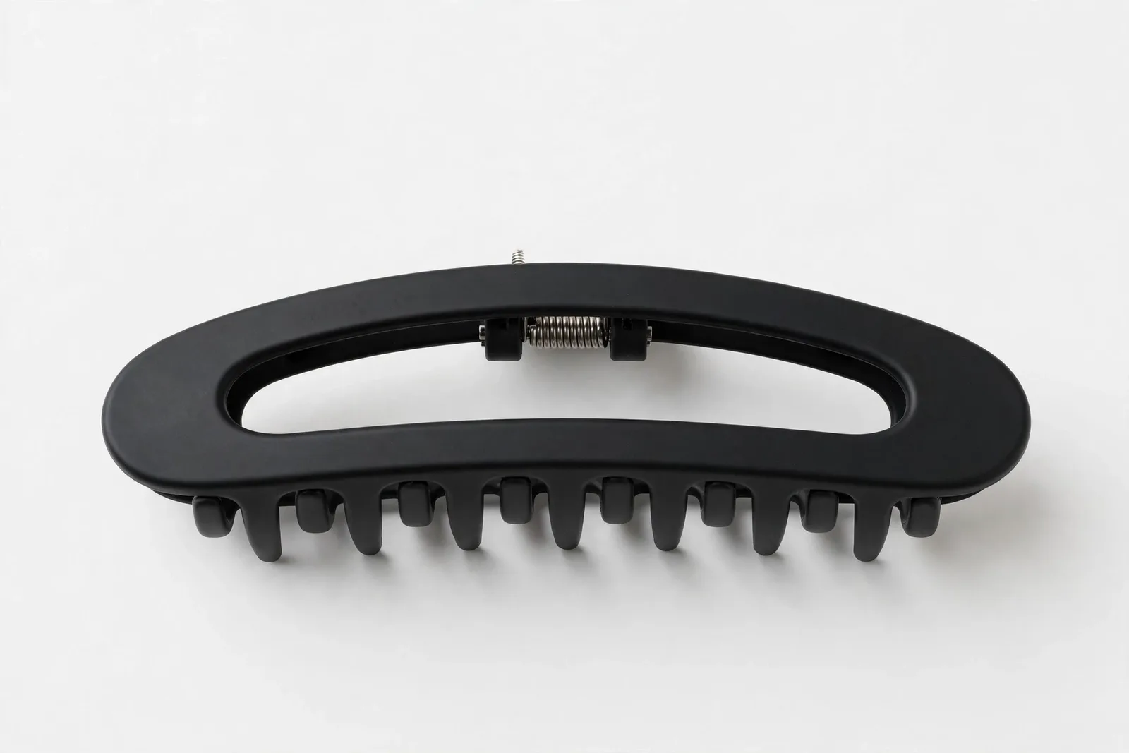 Black Flat Lay-Down Claw Clip, studio product photo on white background