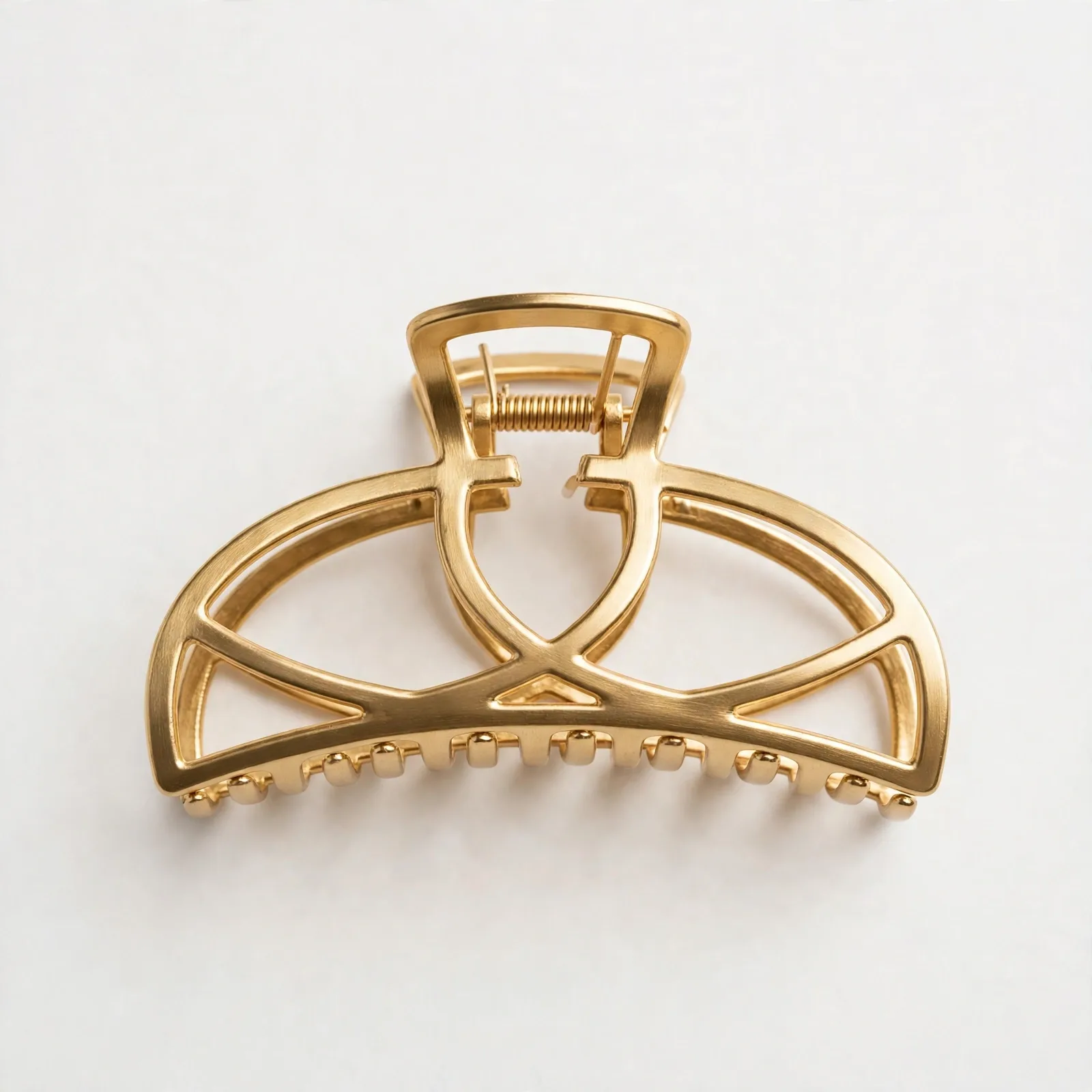Gold Hollow Metal Claw Clip, studio product photo on white background