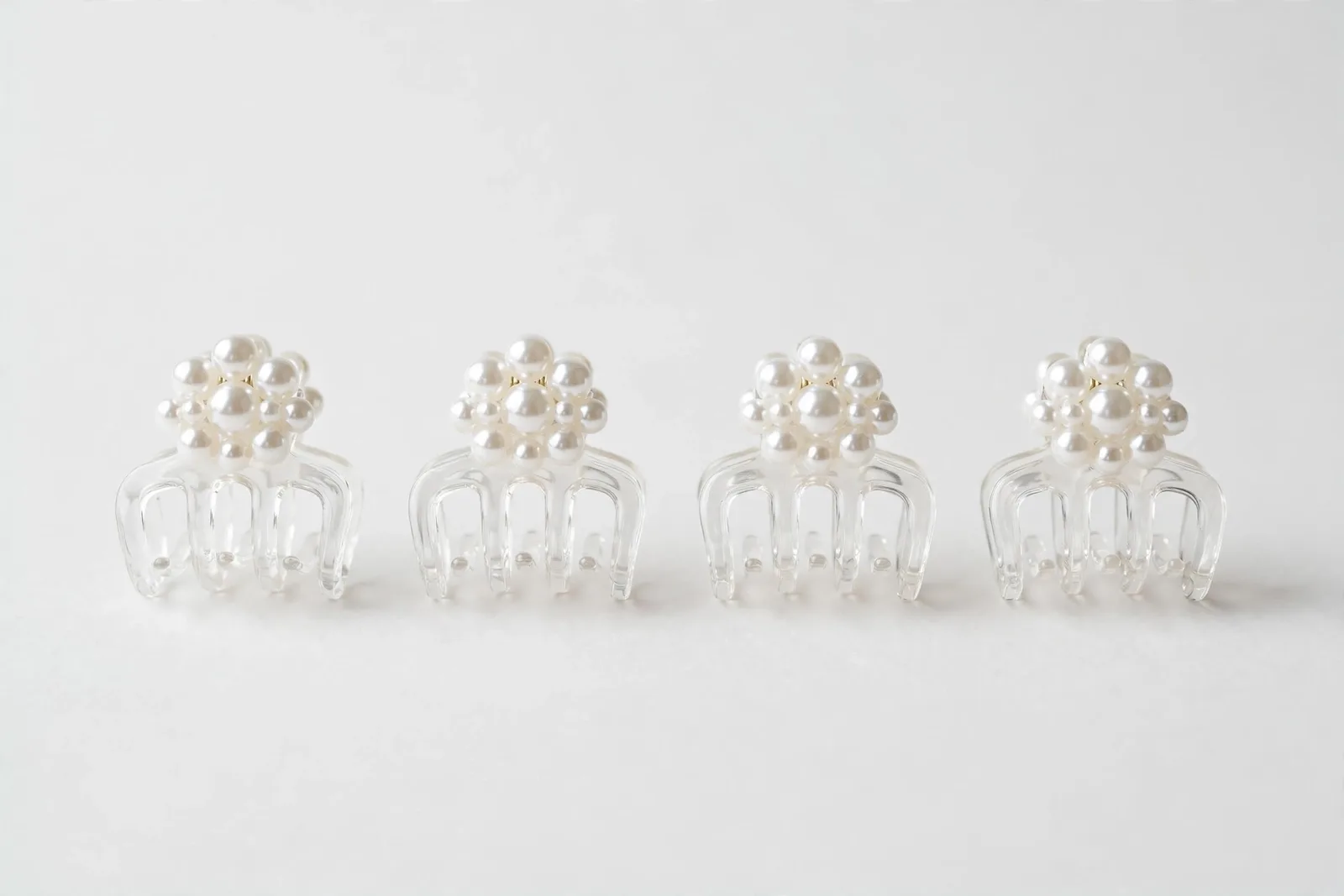 White Mini Pearl Claw Clips (4-Pack), studio product photo on white background