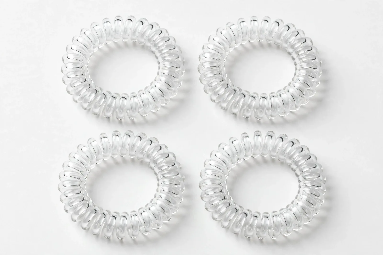 Clear Spiral Coil Hair Ties (4-Pack), studio product photo on white background